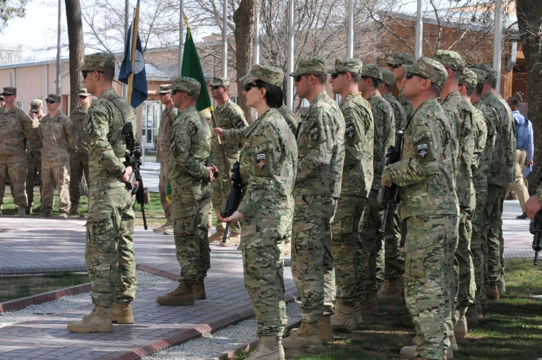 a group of soldiers standing next to each other in uniform