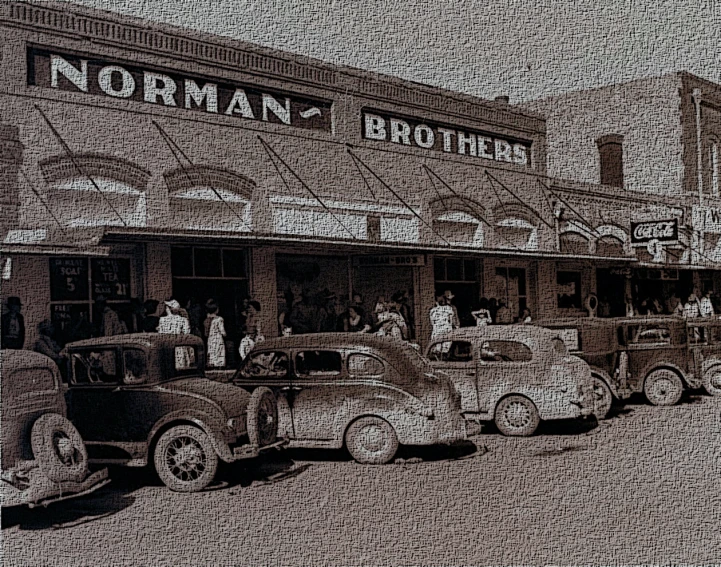 a group of old fashioned cars parked outside a store