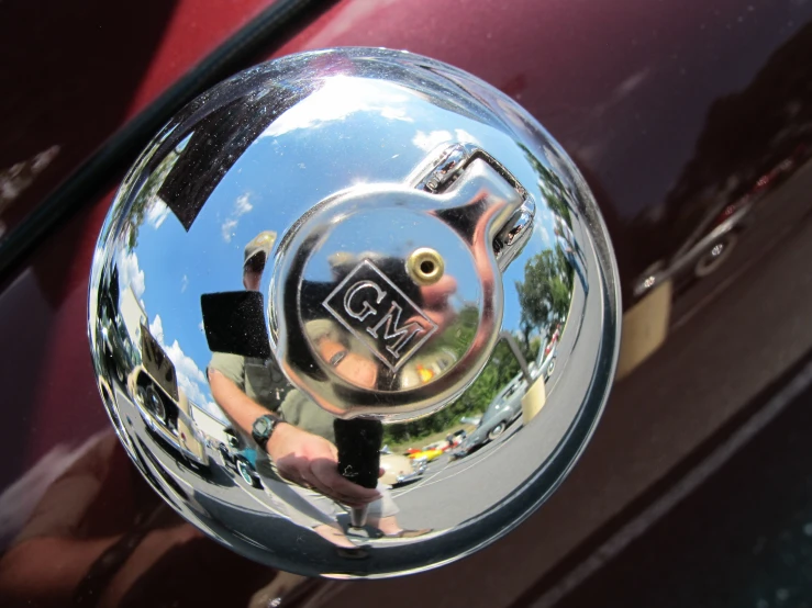 there is a shiny metallic car hood ornament