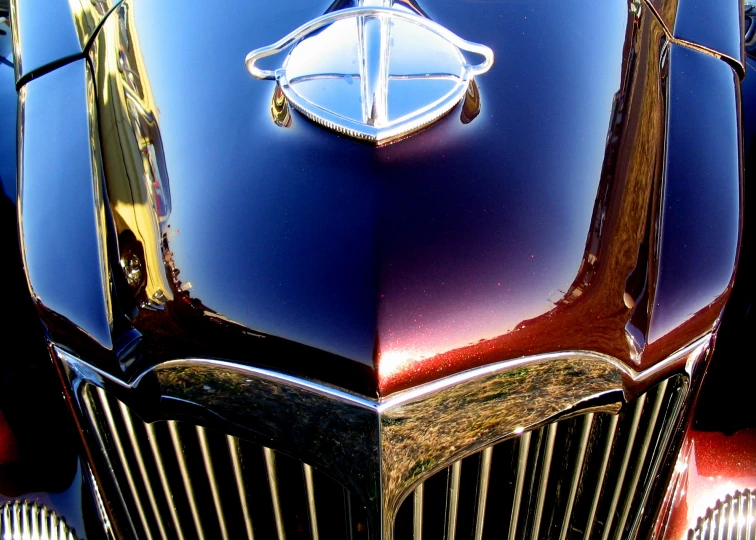 a vintage red and blue car hood or grill
