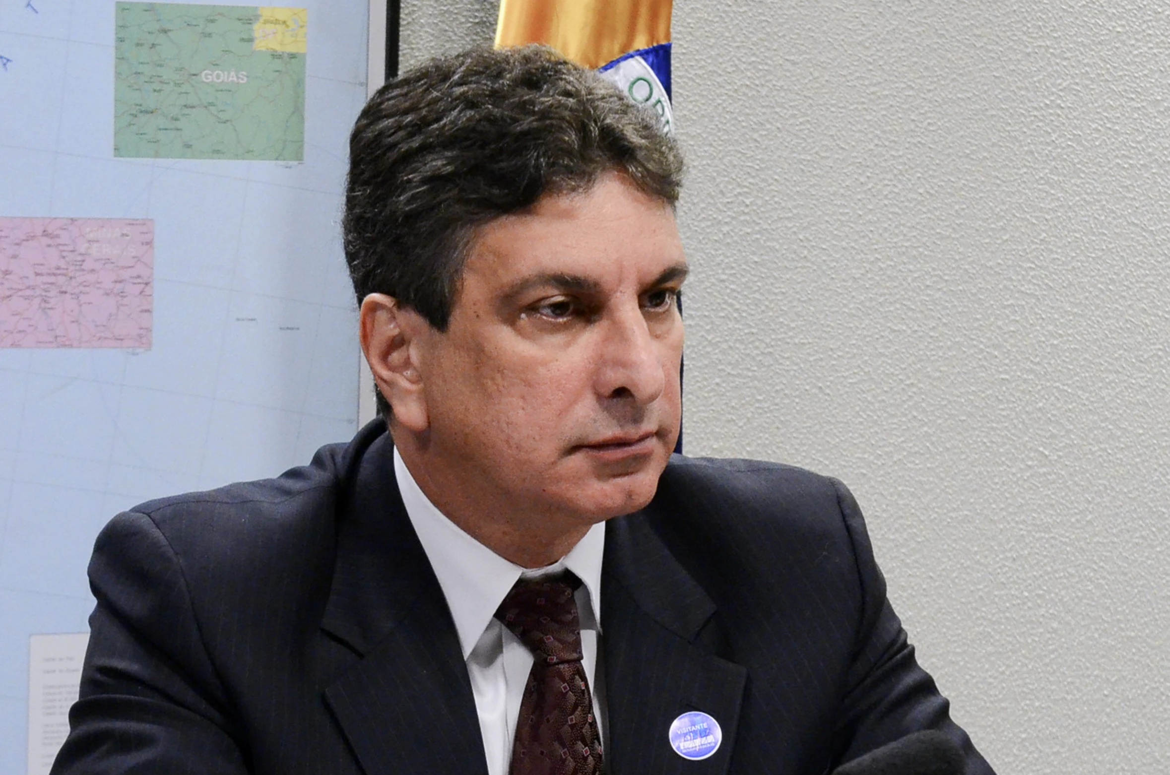 a man sits in front of a podium