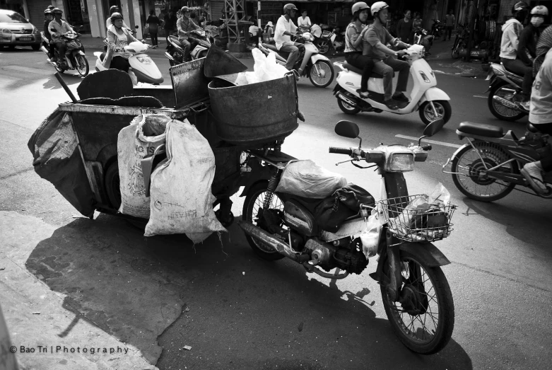 a black and white po of motorcycle with bags on it