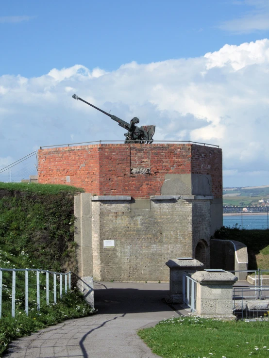 a brick building with a telescope on top of it