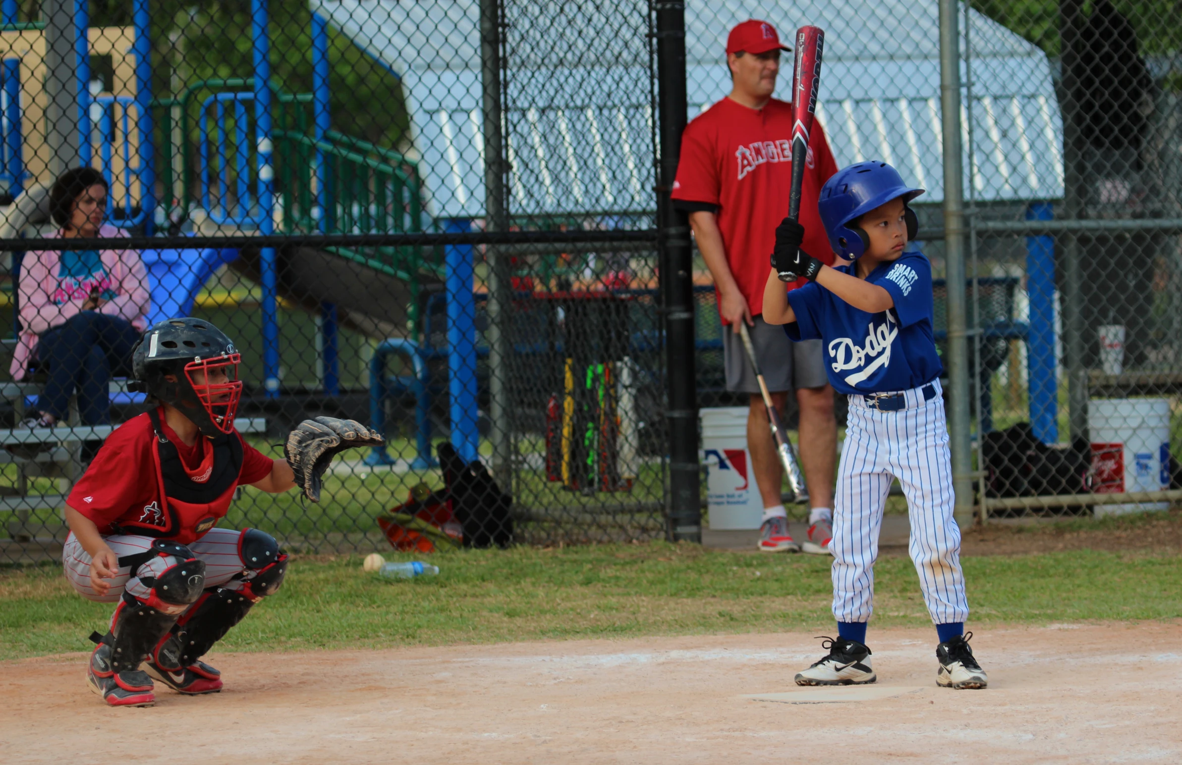 a young baseball player waiting for the ball