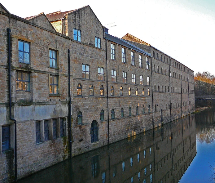 a brick building near a body of water