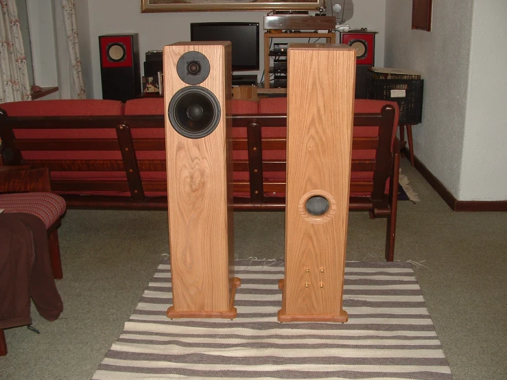 two large speakers are standing near each other