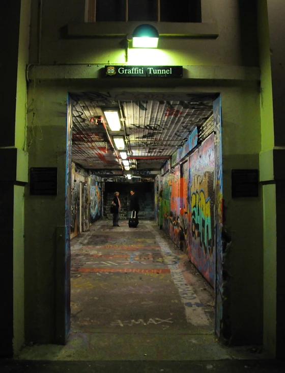 the tunnel is filled with graffiti in the city