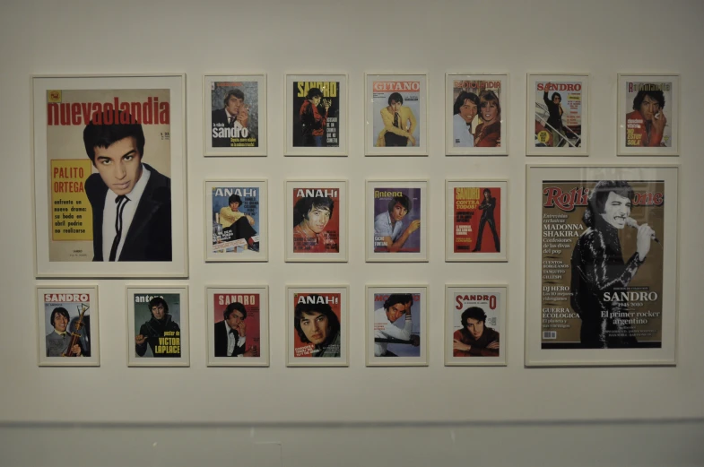 a large variety of magazine covers mounted on a wall