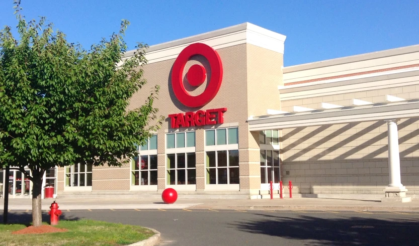 a target building with the entrance open with trees