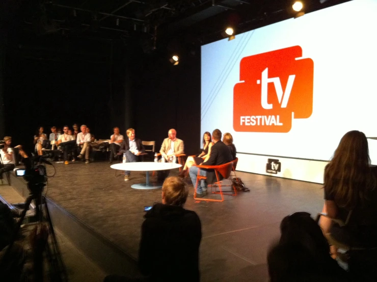 the people are at a television festival and they have microphones