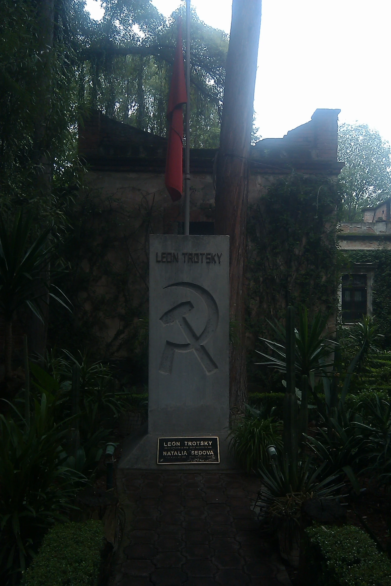 monument with a flag flying at the base