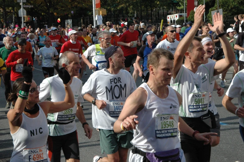 group of people running in a race, during a parade