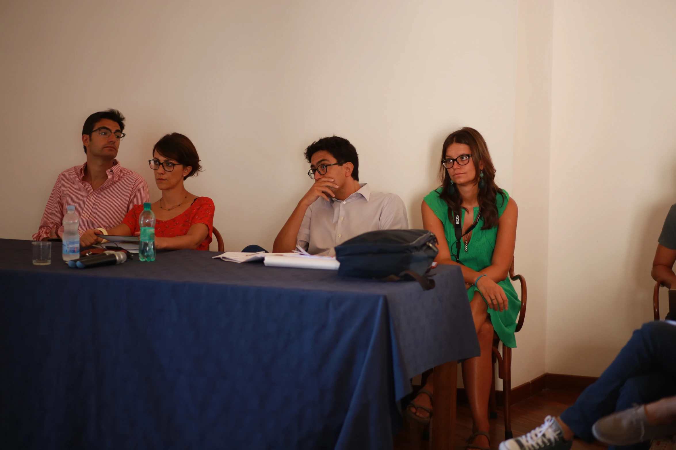 four people are sitting at a table