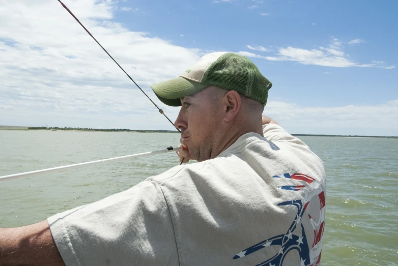 a man sailing in a boat in the ocean