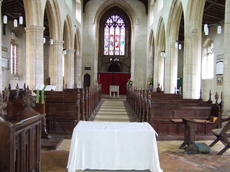an empty chapel with pews lined up
