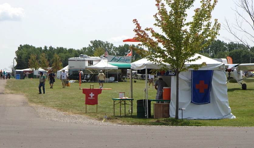 there are many tents set up outside on the grass