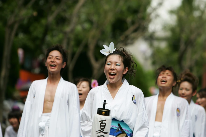 some women with white clothes are smiling