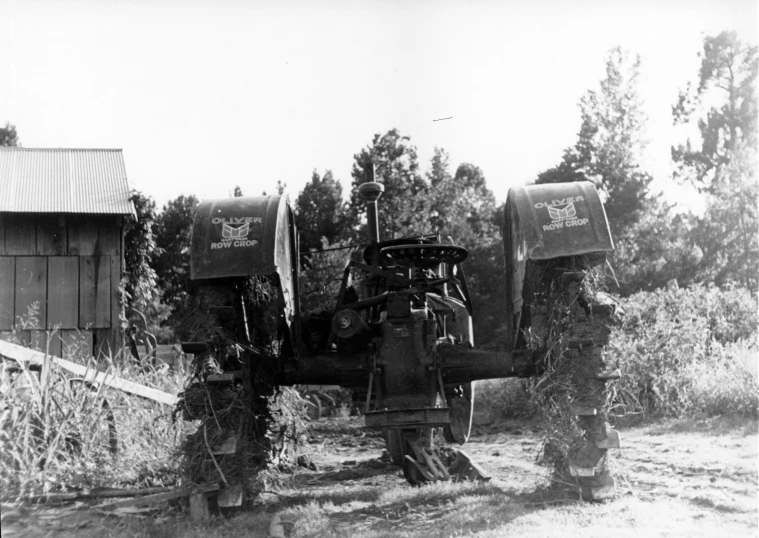 an old tractor that is in a field