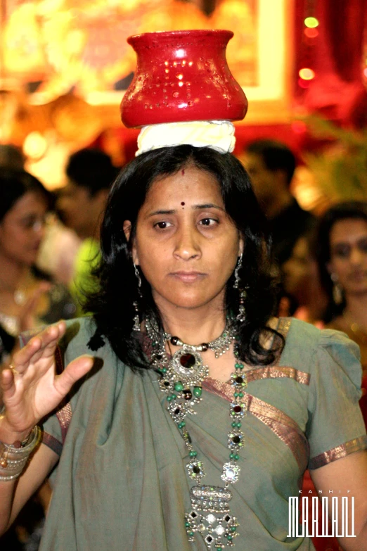 an indian woman standing in a group with jewelry