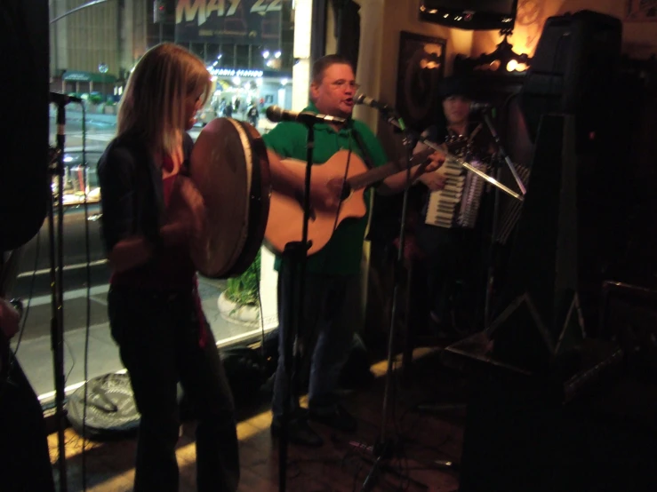 musicians are gathered to perform at a restaurant