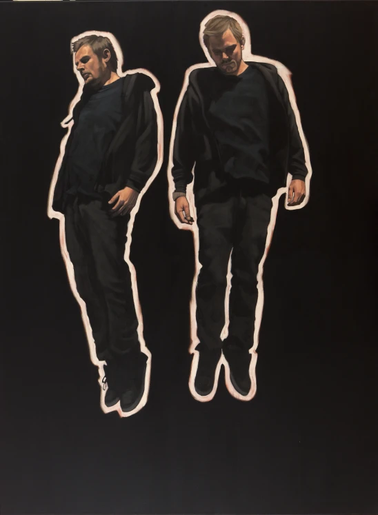 two men are standing next to each other in black clothes