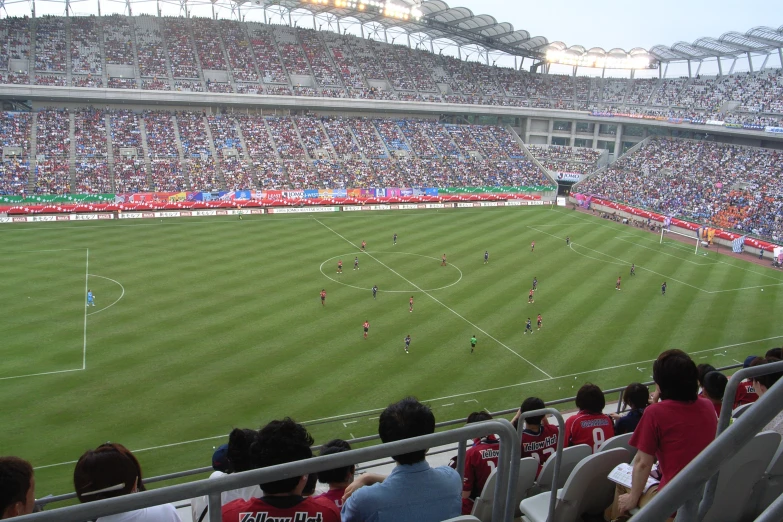 an empty soccer stadium with a large crowd