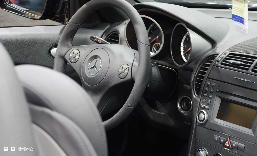 the dashboard and steering wheel in a compact car