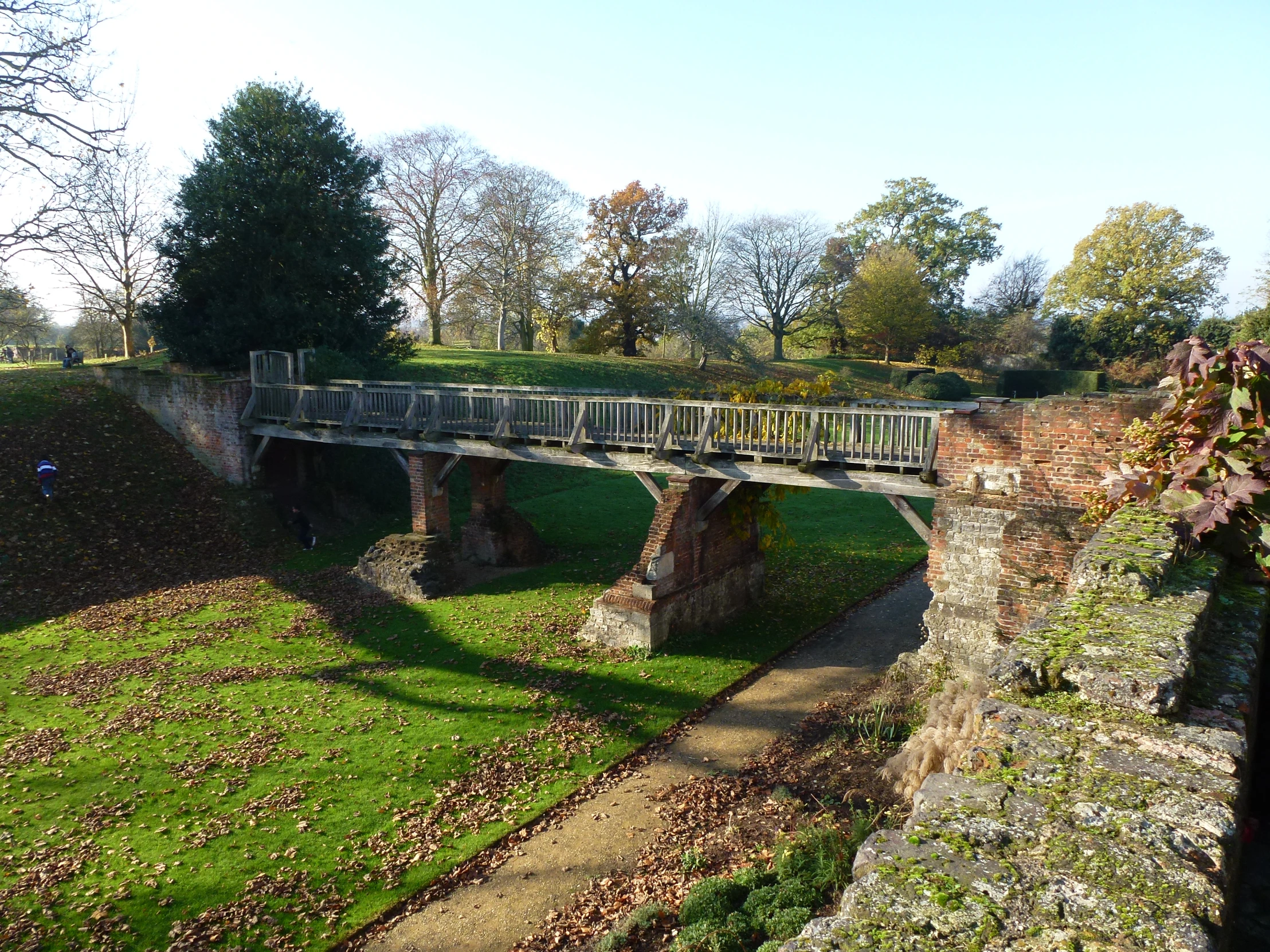 the bridge across the river is next to the path