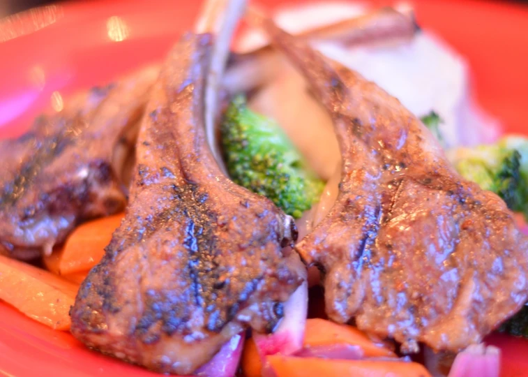 a meat and vegetable dish with broccoli on the side