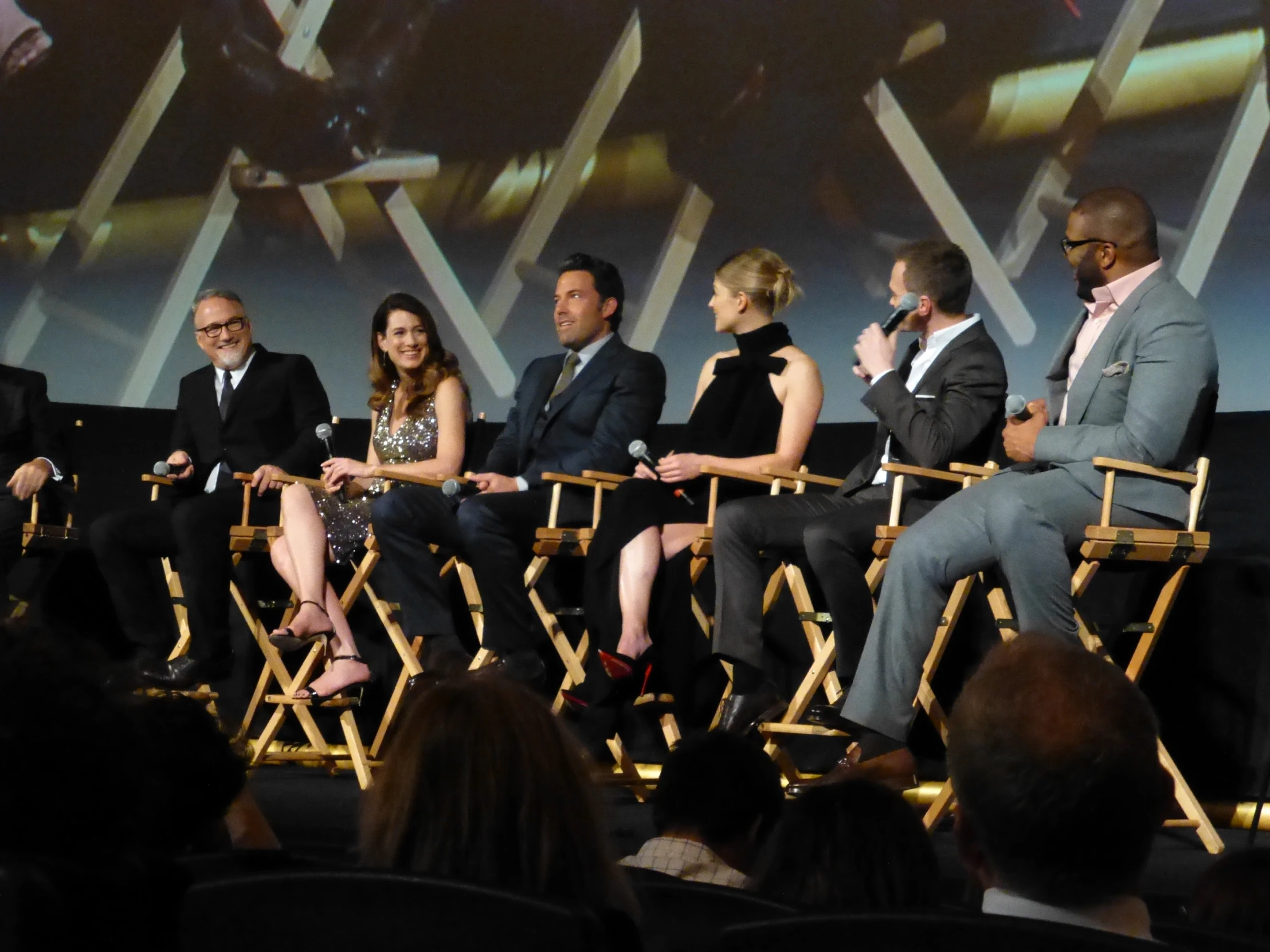 the cast of catching fire are sitting together on stage at an event