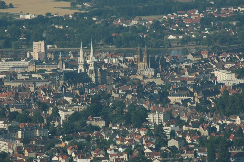 view from the top of the mountain of a city with churches