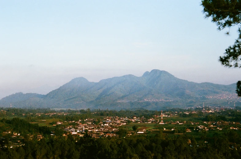 a view of a city with mountains in the background