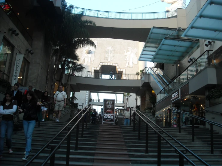 a number of stairs with many people walking in between