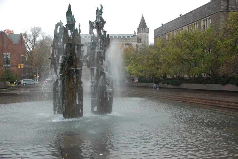 a fountain with three fountains is spewing water
