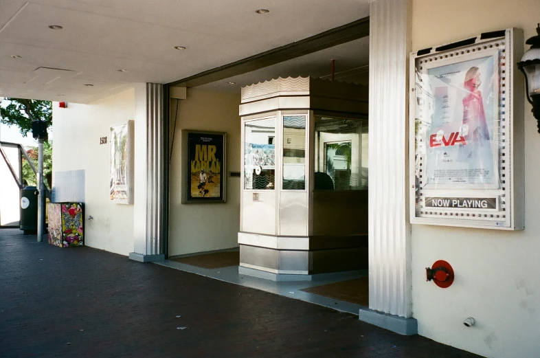 a street entrance with old fashioned phone booth