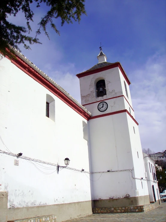 white church with red trim and a steeple