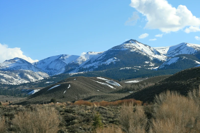 some very large snowy mountains in the distance