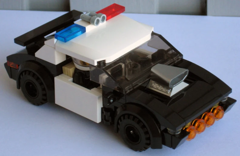 an image of a small toy cop car