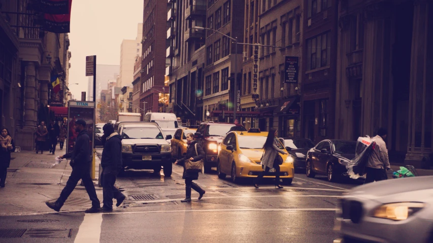 people crossing in the street at an intersection