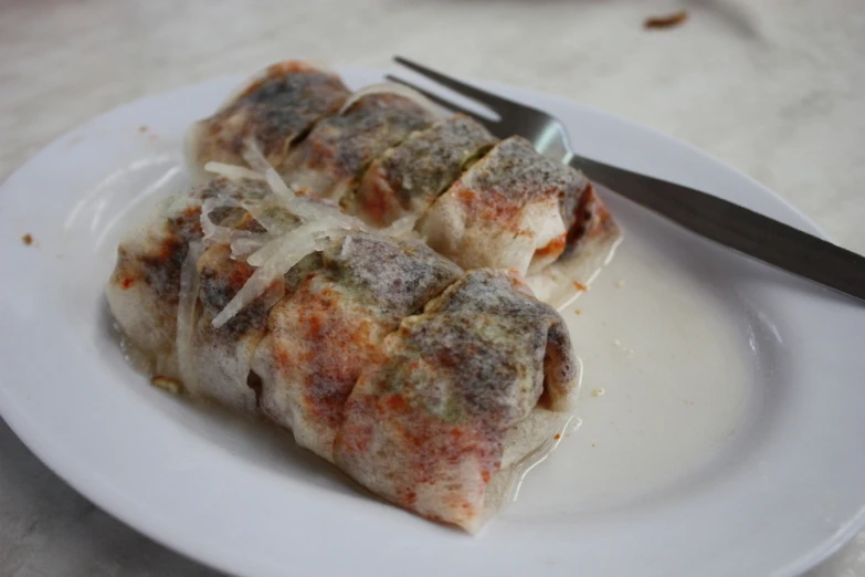 some kind of meat stuffed with cheese and melted onions