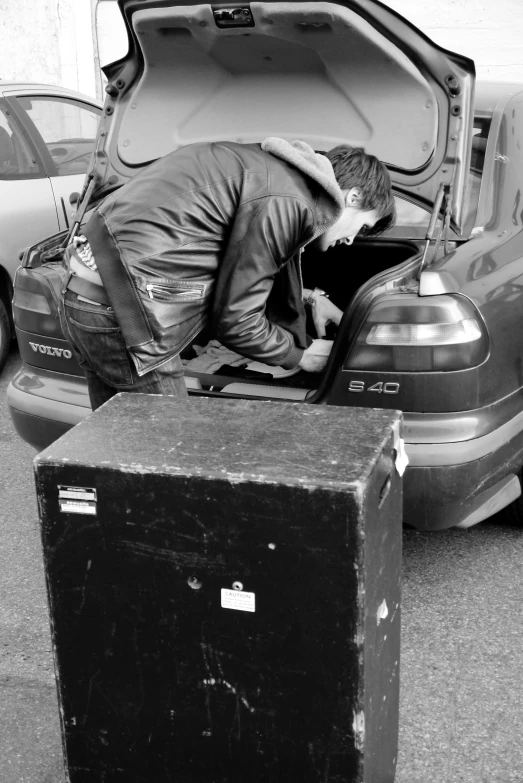 a car that is parked with its trunk open