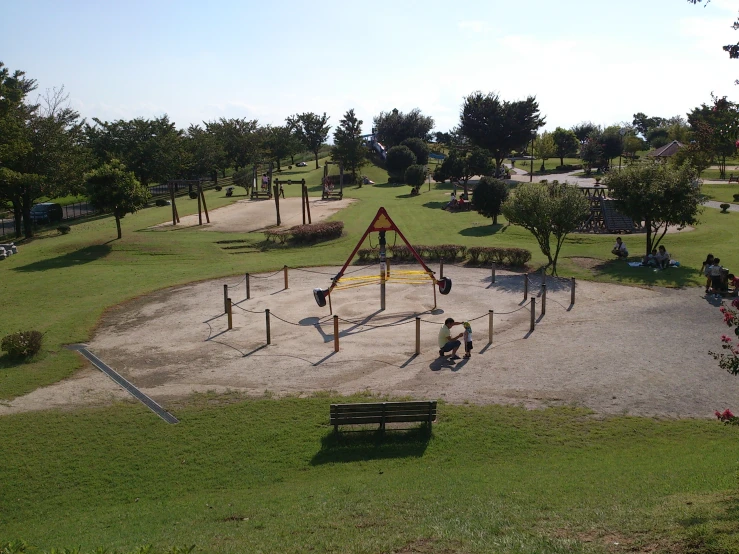 an empty play area in the middle of a park