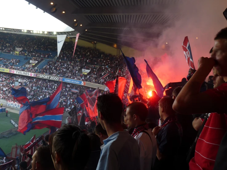 the fans are watching their team in a stadium