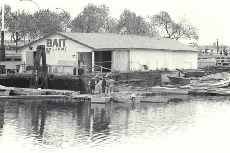 a couple of boats parked next to a pier