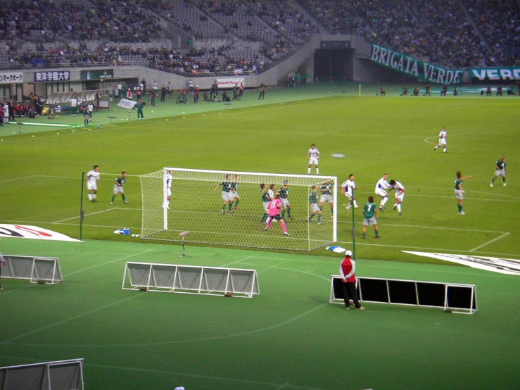 a group of people are on a field playing soccer