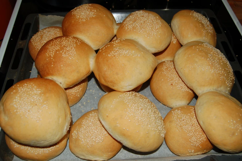 some buns sitting in an oven ready to be cooked