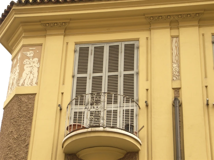 two balconies and a balcony below an old building