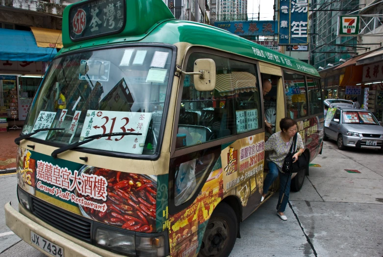 a food cart with people standing on the side walk