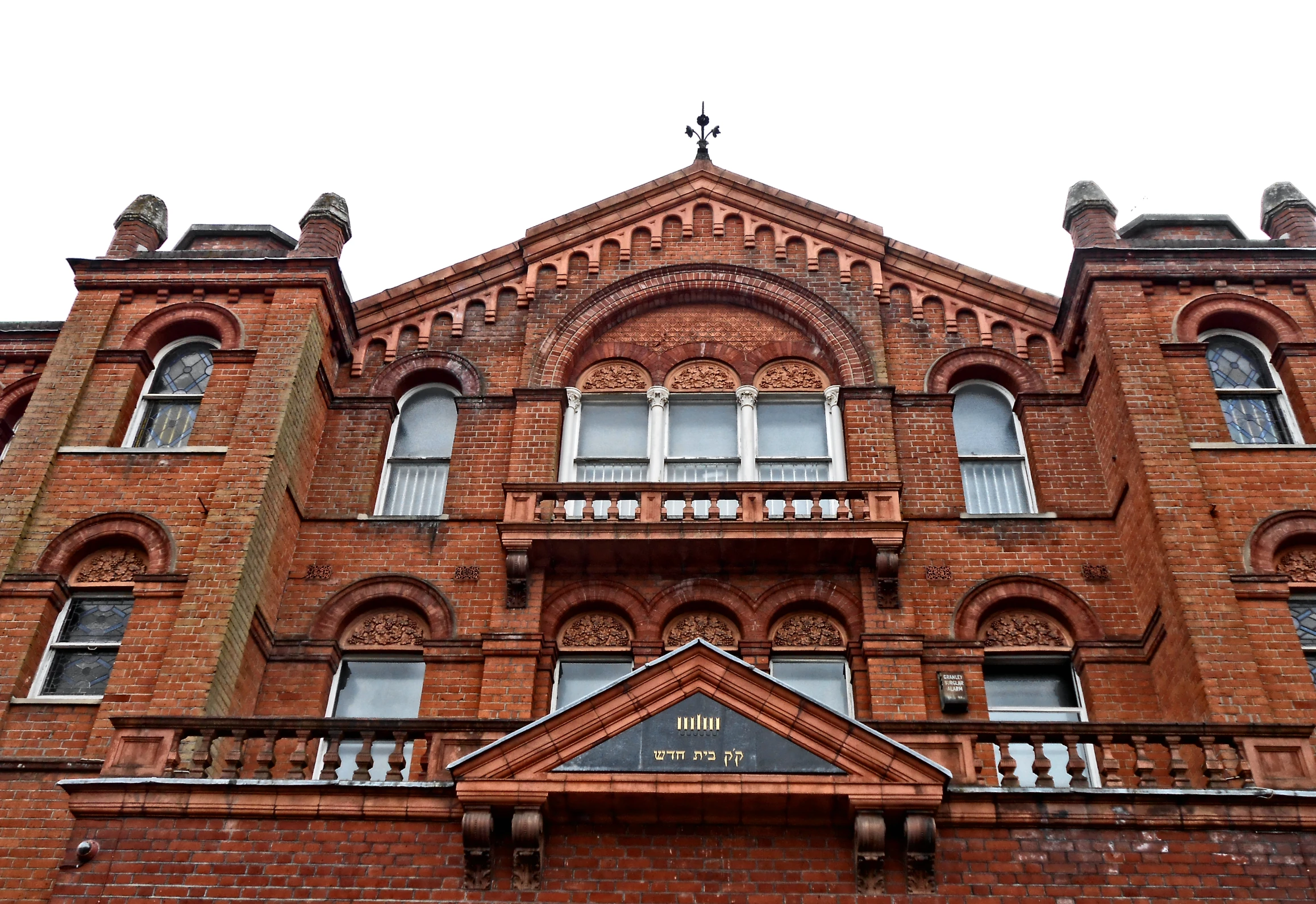 an old brick building with two stories and a tower