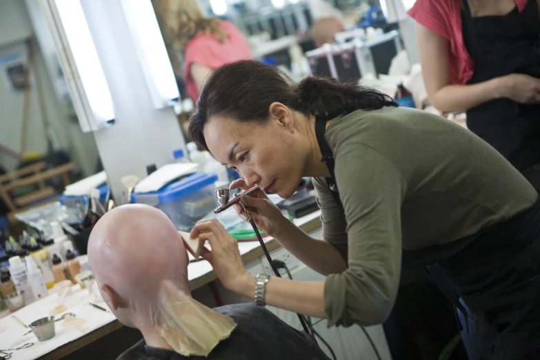 a woman  another mans hair in the salon